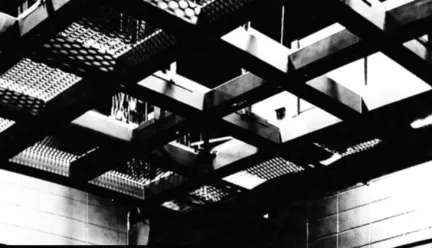 people on stage, chairs near 